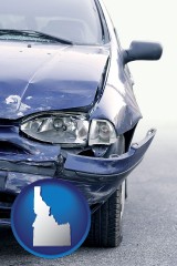 idaho map icon and an automobile accident, hopefully covered by insurance