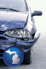 mi map icon and an automobile accident, hopefully covered by insurance